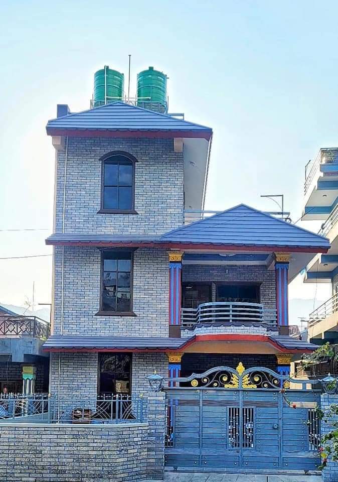 Residential building with stone exterior and covered entrance